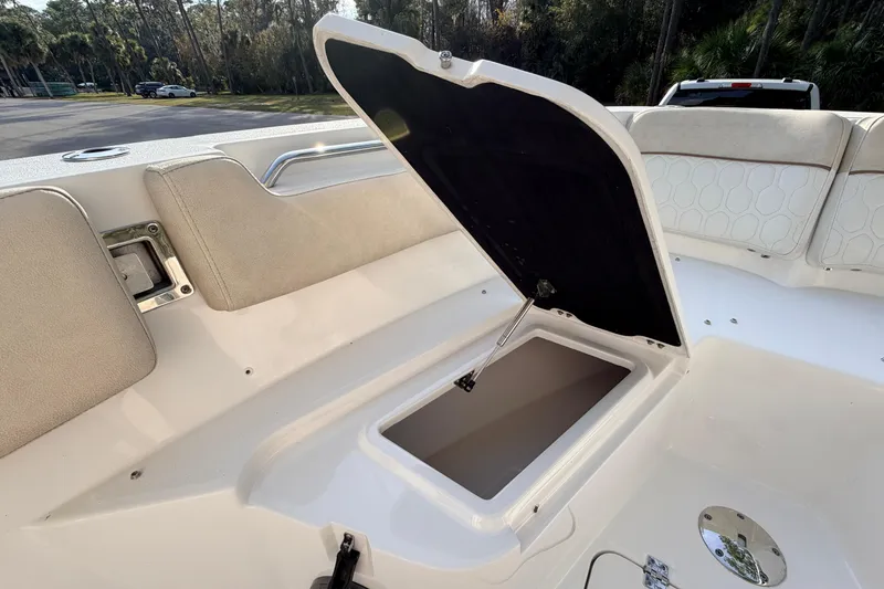 Slide: The Image of 2022 Sea Fox 228 Commander boat with open storage compartment on deck. - 35