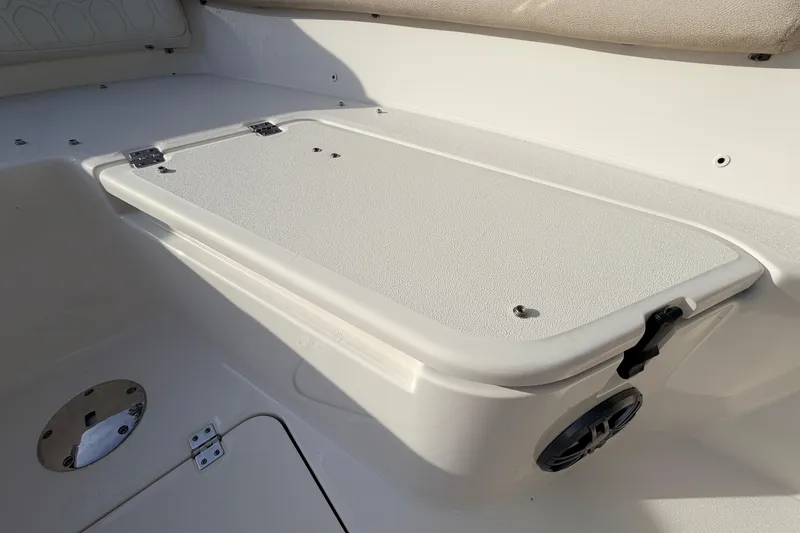 Slide: The Image of 2022 Sea Fox 228 Commander boat interior with storage compartment and seating area. - 37