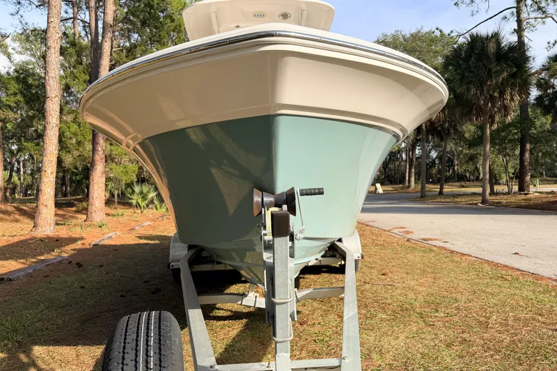 Slide: The Image of 2022 Sea Fox 228 Commander boat on trailer in wooded area. - 5