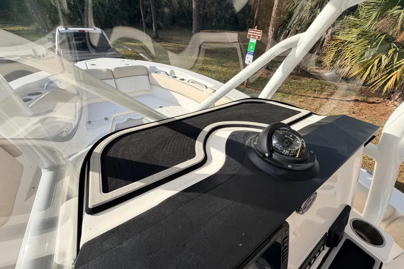 Slide: The Image of 2022 Sea Fox 228 Commander boat interior with compass and seating area. - 54