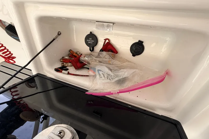 Slide: The Image of Storage compartment of 2022 Sea Fox 228 Commander with accessories and USB input. - 58