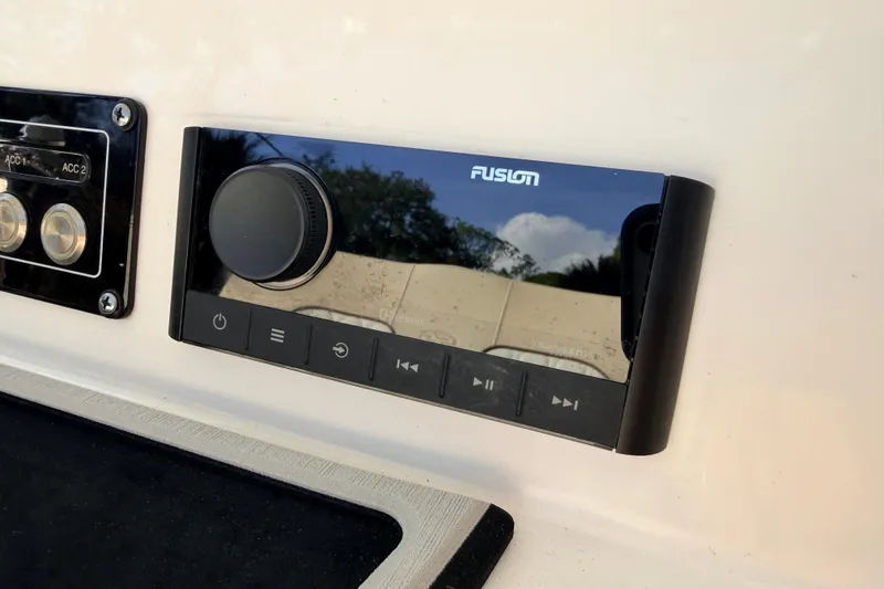 Slide: The Image of Fusion audio control panel on 2022 Sea Fox 228 Commander boat dashboard. - 60