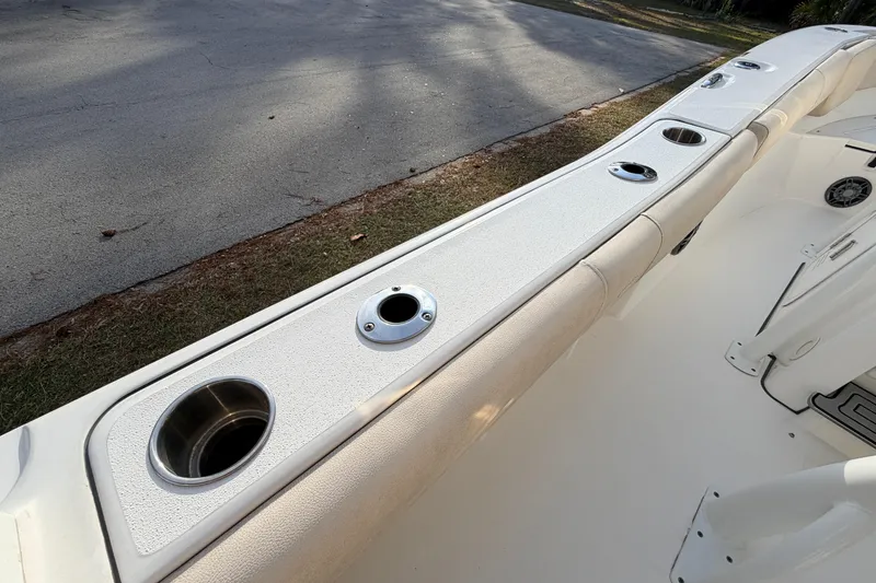 Slide: The Image of 2022 Sea Fox 228 Commander boat interior with cup holders and rod holders. - 65