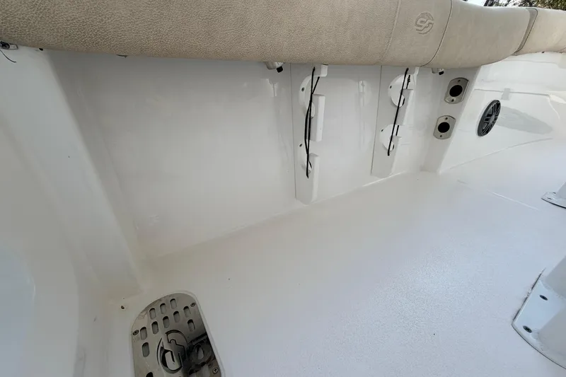 Slide: The Image of 2022 Sea Fox 228 Commander boat interior with cushioned seating and speaker system. - 67