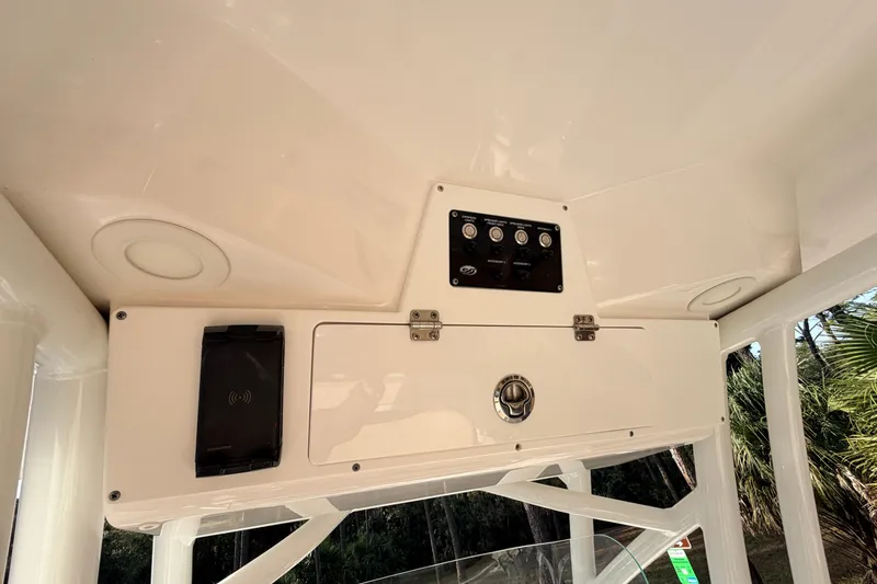 Slide: The Image of 2022 Sea Fox 228 Commander boat console with control panel and storage compartment. - 69