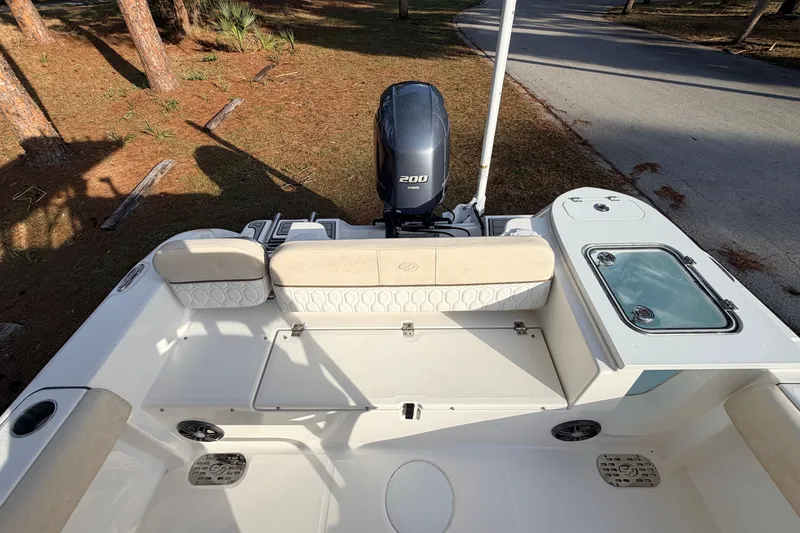 Slide: The Image of 2022 Sea Fox 228 Commander boat interior with Yamaha 200 engine, seating, and storage. - 73
