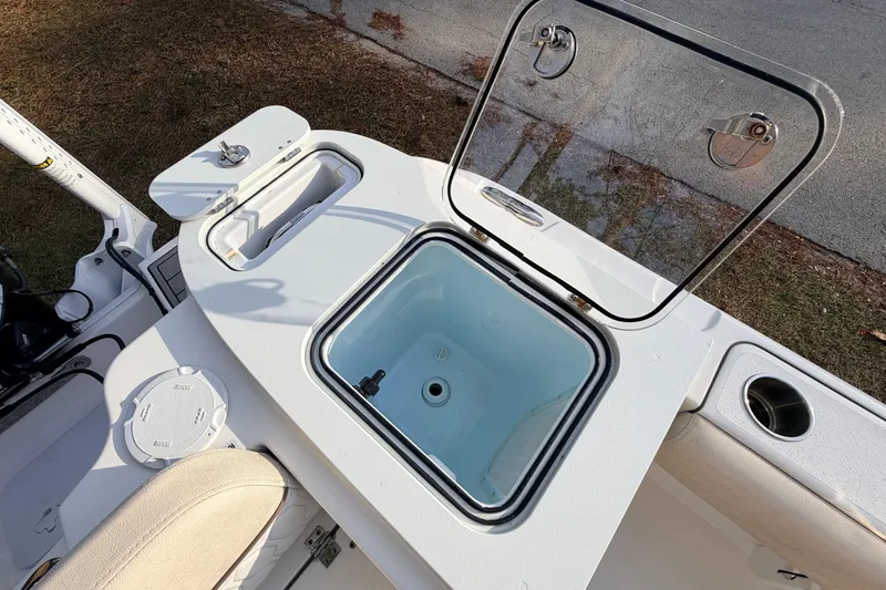 Slide: The Image of 2022 Sea Fox 228 Commander boat with open storage compartment and seating area. - 77