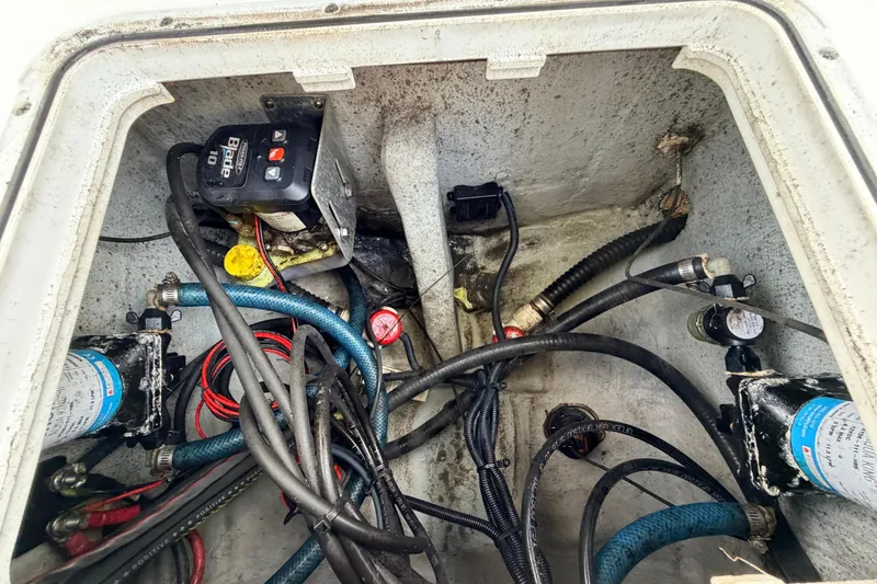 Slide: The Image of Electrical and plumbing components inside a 2022 Sea Fox 228 Commander boat. - 82