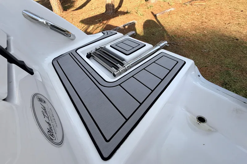 Slide: The Image of 2022 Sea Fox 228 Commander boat deck with ladder and Black Label Marine Group logo. - 84