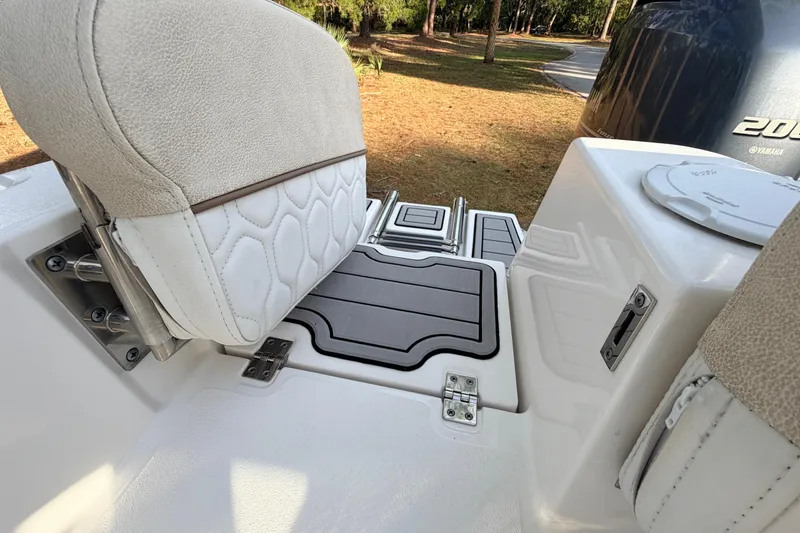 Slide: The Image of 2022 Sea Fox 228 Commander boat interior with cushioned seating and deck details. - 86