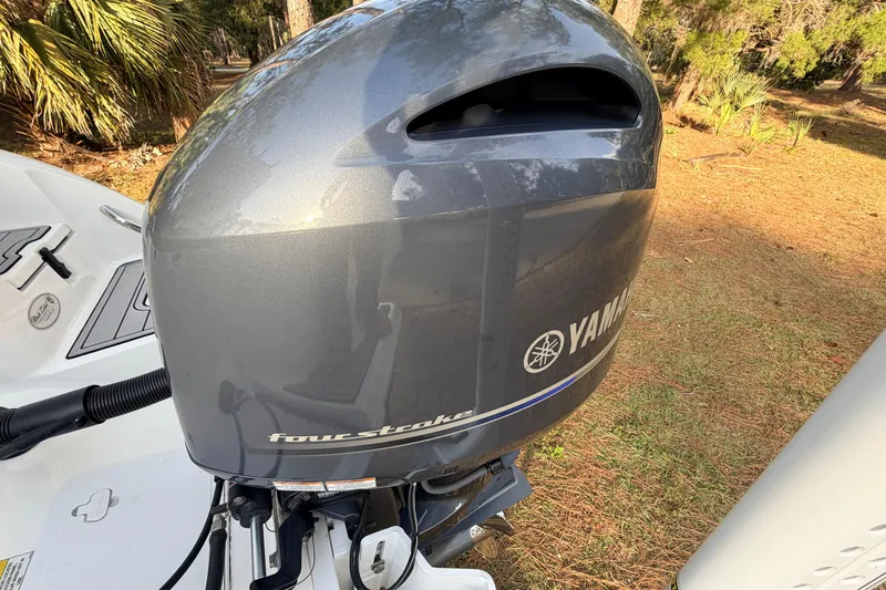 Slide: The Image of Yamaha four-stroke engine on 2022 Sea Fox 228 Commander boat, outdoor setting. - 90
