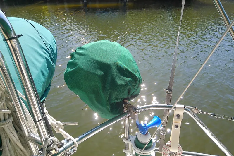 Slide: The Image of Sailboat deck with green covers and equipment, Hunter 30, 1991 model. - 11