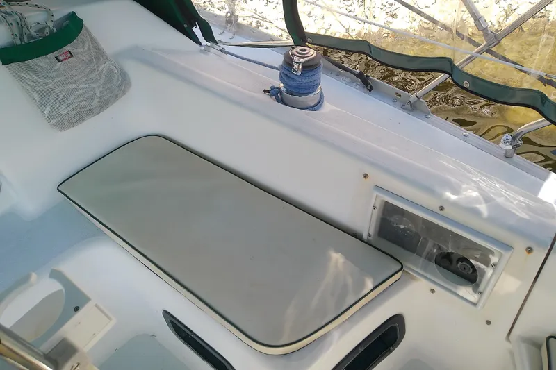 Slide: The Image of Cockpit of 1991 Hunter 30 sailboat with winch and seating area. - 13