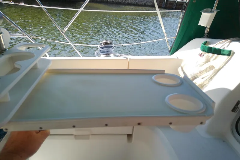 Slide: The Image of Cockpit table with cup holders on a 1991 Hunter 30 sailboat. - 19