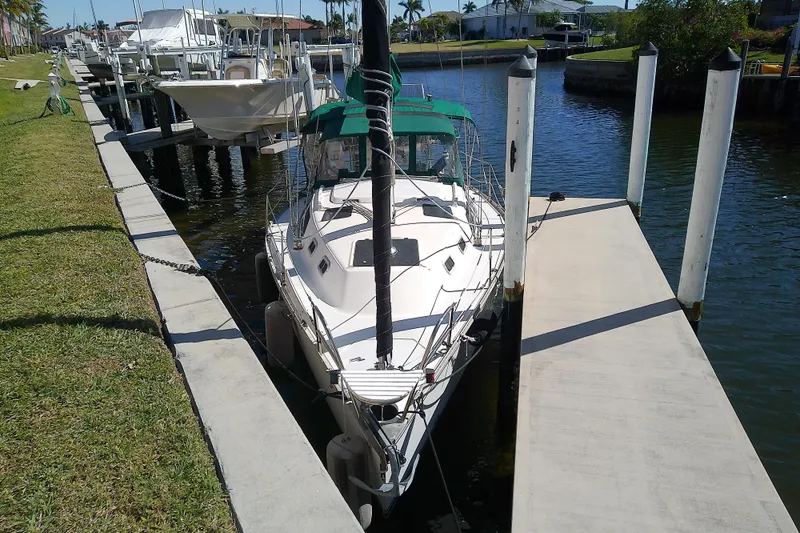 Slide: The Image of Sailboat docked at marina, 1991 Hunter 30 model, sunny day, calm water. - 3