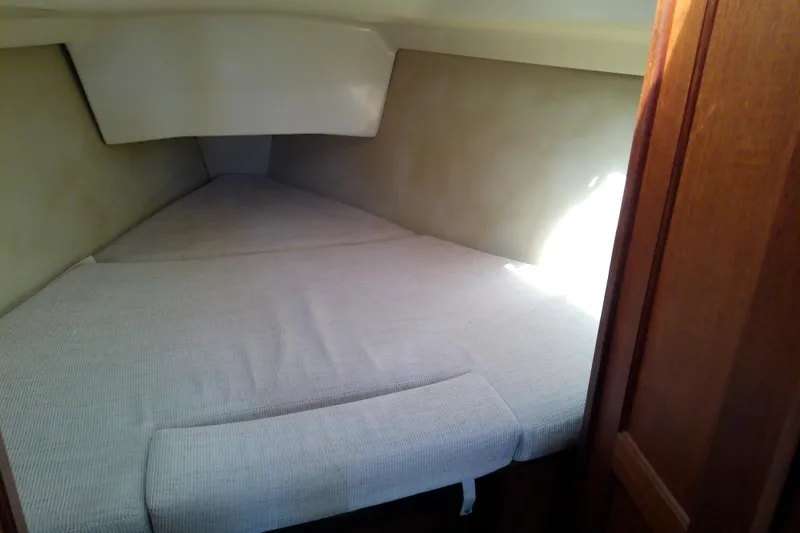 Slide: The Image of Interior cabin of a 1991 Hunter 30 sailboat with a cozy sleeping area. - 37