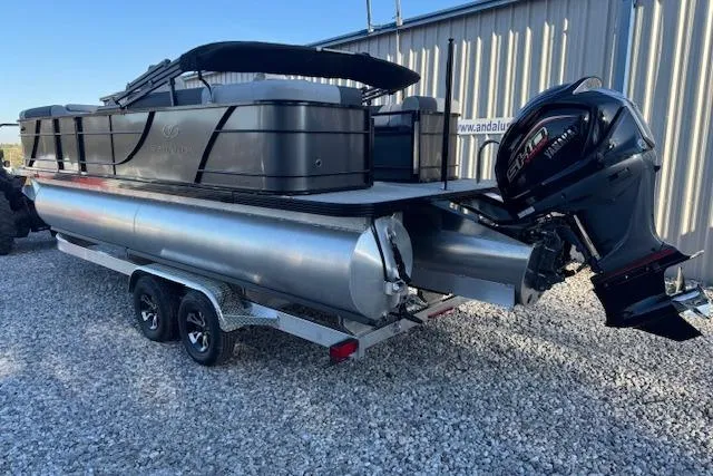 Slide: The Image of 2026 Veranda Relax VR 22 RC pontoon boat on trailer with outboard motor. - 2