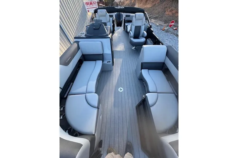 Slide: The Image of 2026 Veranda Relax VR 22 RC pontoon boat interior with gray seating and sleek design. - 5
