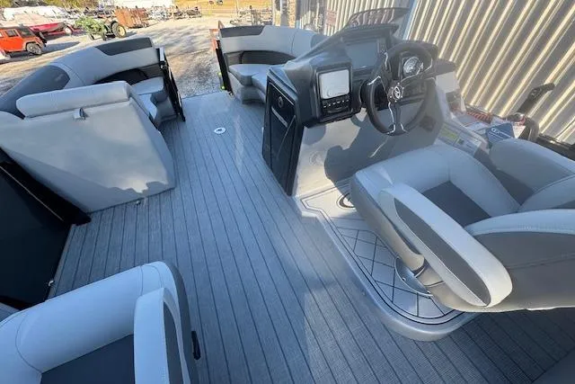 Slide: The Image of 2026 Veranda Relax VR 22 RC pontoon boat interior with modern seating and steering console. - 9