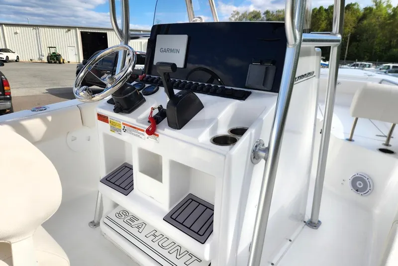 Slide: The Image of 2023 Sea Hunt Ultra 219 boat console with Garmin navigation system and steering wheel. - 12