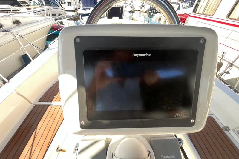 Slide: The Image of Cockpit of 2008 Hunter 36 sailboat with Raymarine navigation display. - 16