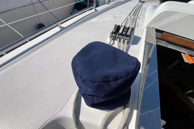 Slide: The Image of Deck of 2008 Hunter 36 sailboat with ropes and winch cover. - 18