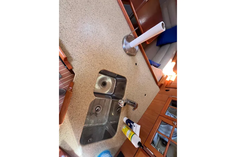 Slide: The Image of Interior of 2008 Hunter 36 sailboat showing kitchen sink and countertop. - 28