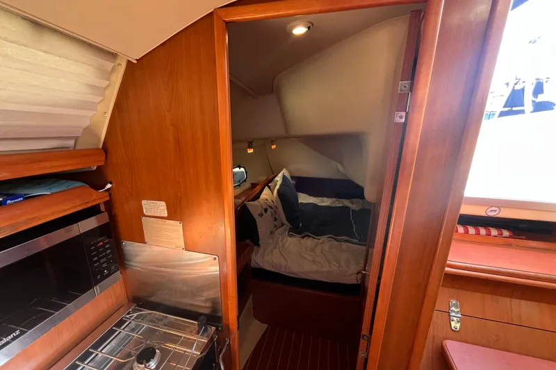 Slide: The Image of Interior of 2008 Hunter 36 sailboat with cozy cabin and modern kitchen amenities. - 36