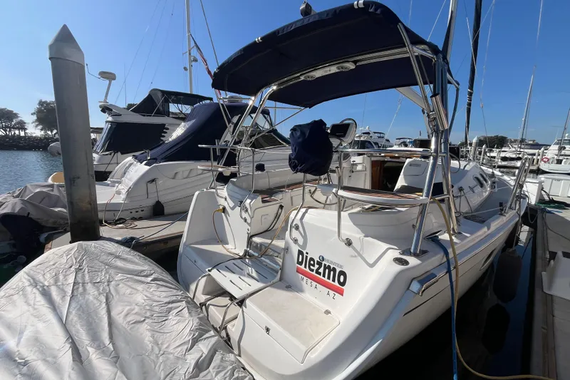 Slide: The Image of 2008 Hunter 36 sailboat docked at marina under clear blue sky. - 4