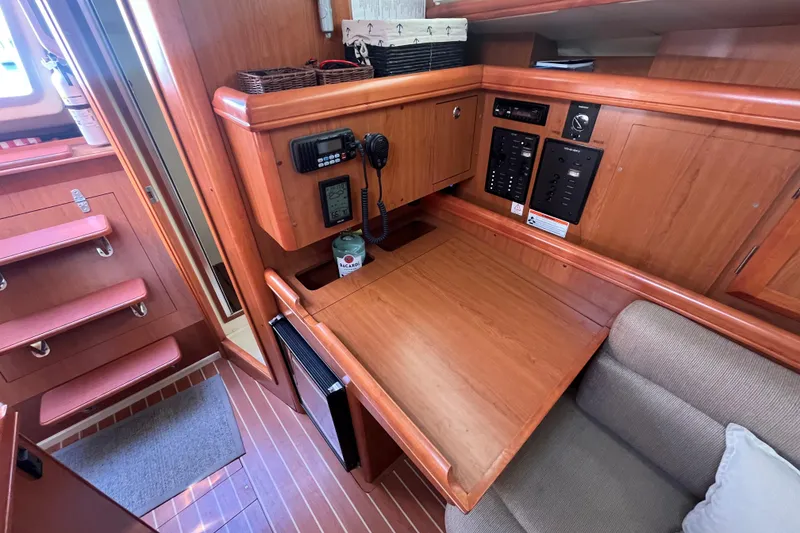 Slide: The Image of Interior of 2008 Hunter 36 sailboat with navigation station and wooden cabinetry. - 41
