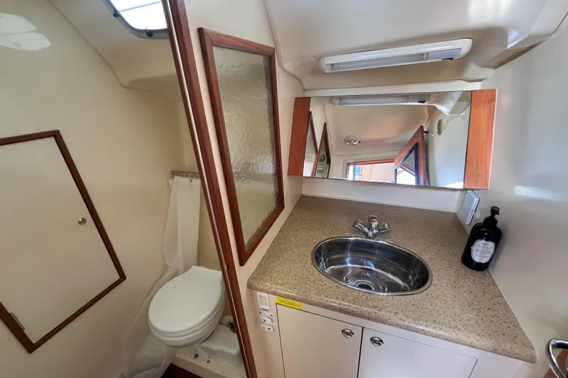 Slide: The Image of 2008 Hunter 36 yacht bathroom with sink, mirror, and toilet. - 46