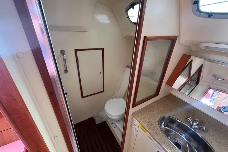 Slide: The Image of 2008 Hunter 36 yacht bathroom with sink, mirror, and toilet. - 47