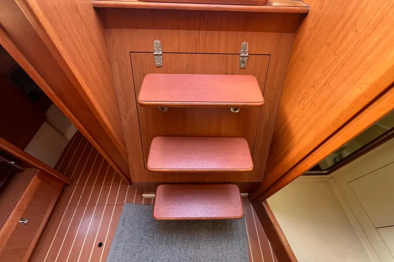 Slide: The Image of Wooden interior steps on a 2008 Hunter 36 sailboat. - 48