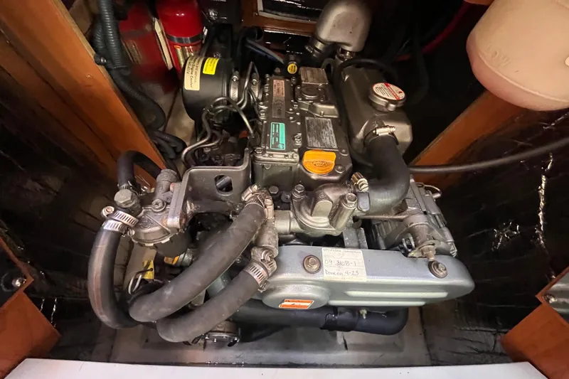 Slide: The Image of Engine compartment of a 2008 Hunter 36 sailboat, featuring detailed mechanical components. - 50