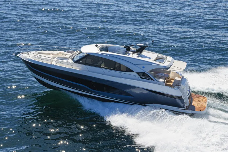 The Image of Manufacturer Provided Image: 2026 Riviera 5600 Sport Yacht Platinum Edition cruising on open water. - 0