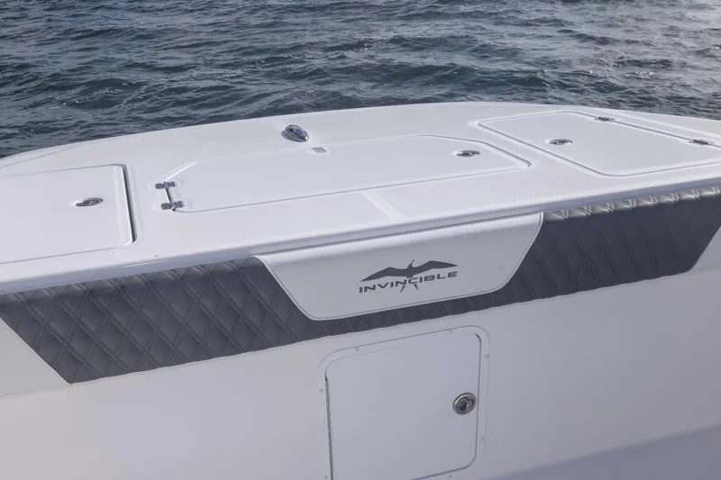 Slide: The Image of 2023 Invincible 35 Catamaran boat deck with ocean backdrop. - 17