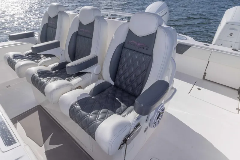 Slide: The Image of Luxury seating on 2023 Invincible 35 Catamaran, featuring plush, diamond-stitched upholstery. - 28