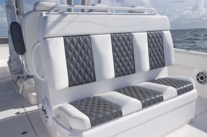 Slide: The Image of Luxurious seating on 2023 Invincible 35 Catamaran with quilted upholstery, ocean backdrop. - 33