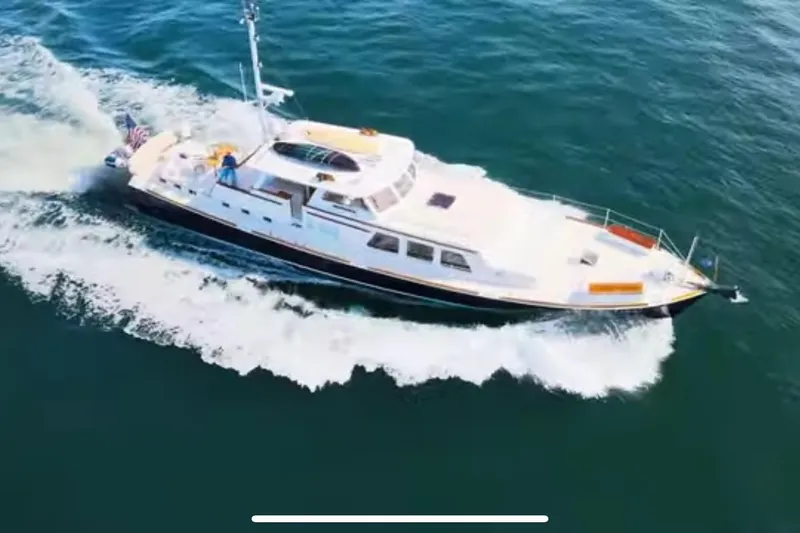 The Image of 1969 Islander 72 Aft Cabin Motor Yacht cruising on open water. - 0