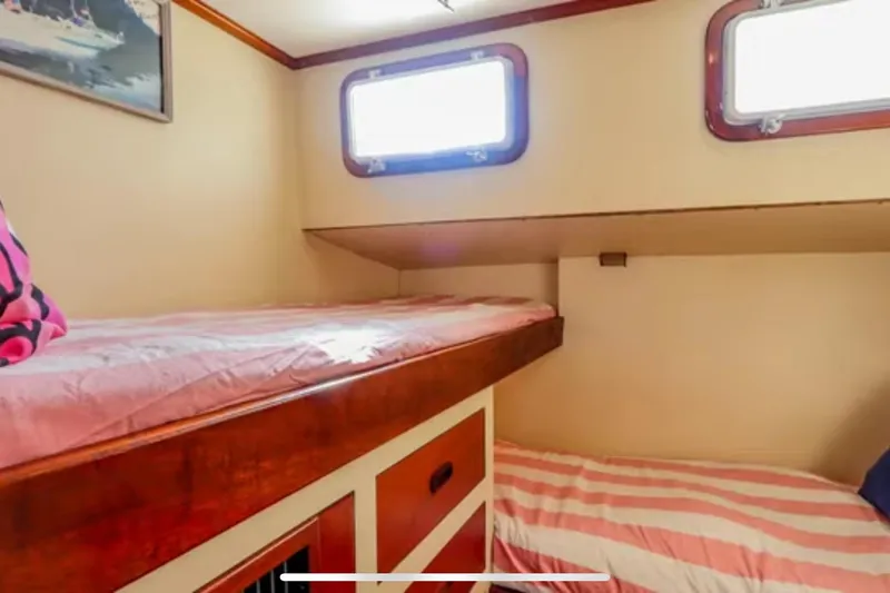 Slide: The Image of Interior cabin of 1969 Islander 72 Aft Cabin Motor Yacht with bunk beds. - 20