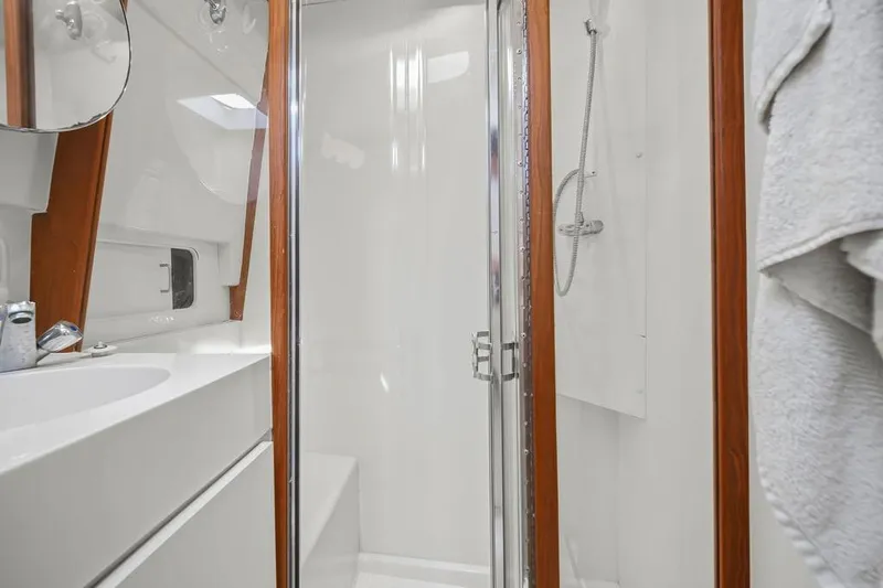 Slide: The Image of Bathroom interior of 1998 Mainship 350 Trawler with shower and sink. - 22