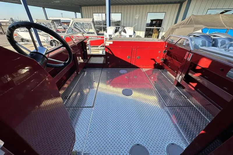 Slide: The Image of Interior view of 2026 Hewescraft 270 Pacific Explorer boat, featuring a sleek, metallic finish. - 11