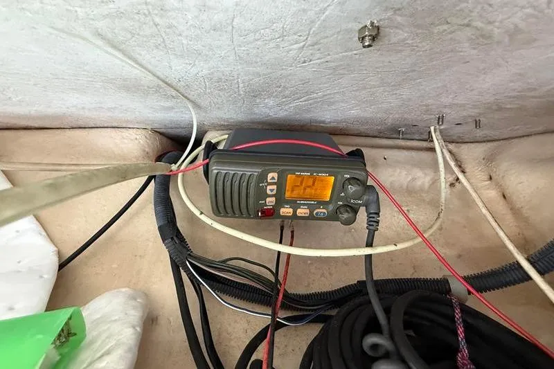 Slide: The Image of VHF radio installation on 2007 Grady-White Bimini 306 boat, with visible wiring. - 22