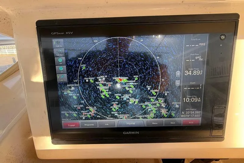 Slide: The Image of Garmin GPS display on 2007 Grady-White Bimini 306 boat, showing navigation and radar data. - 23