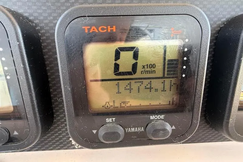 Slide: The Image of Yamaha tachometer display on 2007 Grady-White Bimini 306 boat dashboard. - 24
