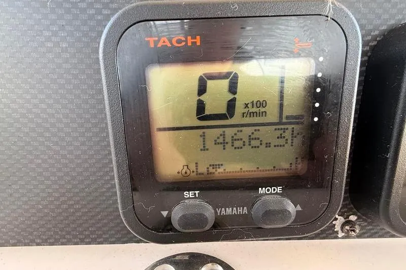 Slide: The Image of Tachometer display on 2007 Grady-White Bimini 306 boat, showing 1466.3 hours. - 25
