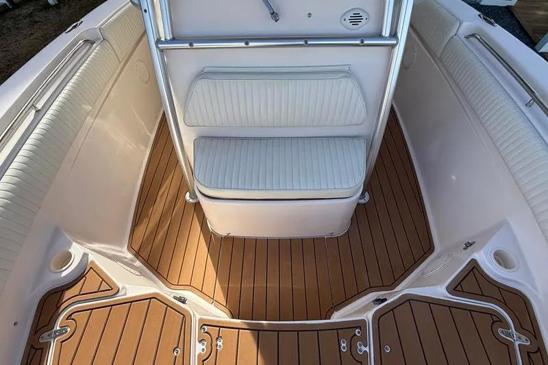 Slide: The Image of 2007 Grady-White Bimini 306 boat interior with cushioned seating and teak flooring. - 30