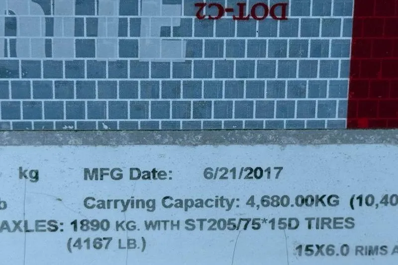 Slide: The Image of Label showing manufacturing date and carrying capacity for Grady-White Bimini 306, 2007 model. - 45