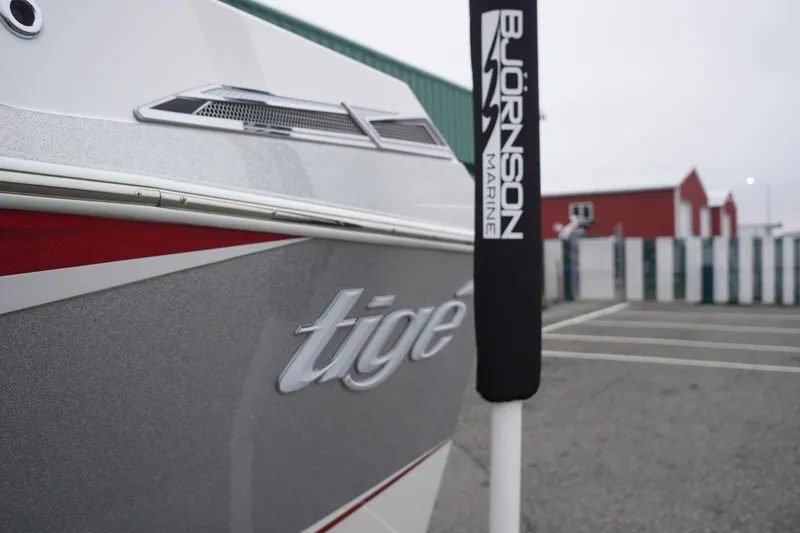 Slide: The Image of 2022 Tigé 22RZX boat at Björnson Marine dealership, showcasing sleek design. - 11