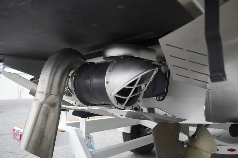 Slide: The Image of Close-up of 2022 Tigé 22RZX boat exhaust and propeller system. - 17